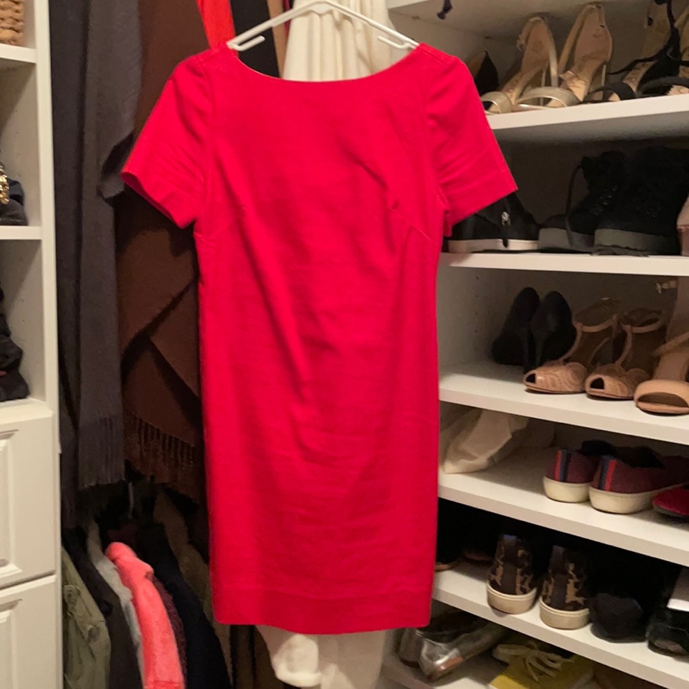 Red fitted dress with bow accent on the back